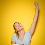 Woman celebrating with fist in the air