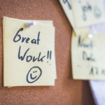 Motivational message on a post-it note saying "great work"