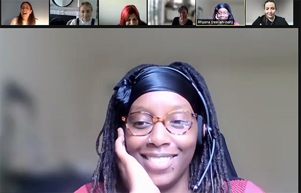 Screen shot of people in a zoom meeting smiling