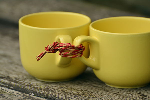Two mugs tied together