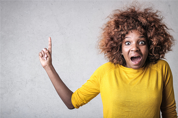 Person looking surprised and pointing up